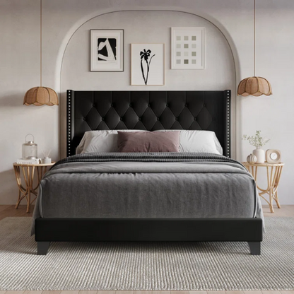 Black queen-size bed with faux leather upholstery, tufted wingback headboard, nailhead trim, and low-profile wood frame.

