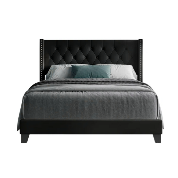 Black full size upholstered platform bed with wingback tufted headboard, silver nailhead trim, and PU faux leather finish on a wood frame.

