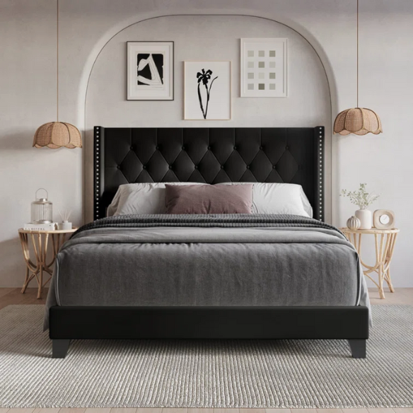 Black full size upholstered platform bed with wingback tufted headboard, silver nailhead trim, and PU faux leather finish on a wood frame.

