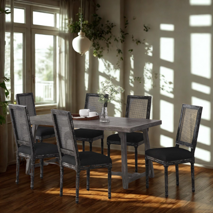 Set of 6 black and grey French country dining chairs with cane backs and upholstered grey seats, featuring fluted legs and rustic charm.

