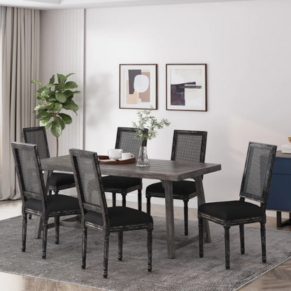 Set of 6 black and grey French country dining chairs with cane backs and upholstered grey seats, featuring fluted legs and rustic charm.

