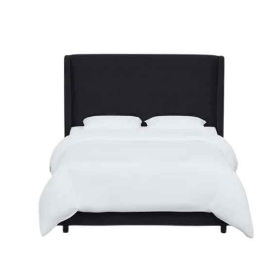 Black king-size upholstered bed in linen fabric with wingback headboard and low-profile black metal legs.

