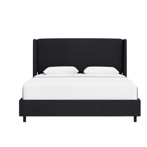 Black king-size upholstered bed in linen fabric with wingback headboard and low-profile black metal legs.

