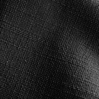 Black king-size upholstered bed in linen fabric with wingback headboard and low-profile black metal legs.


