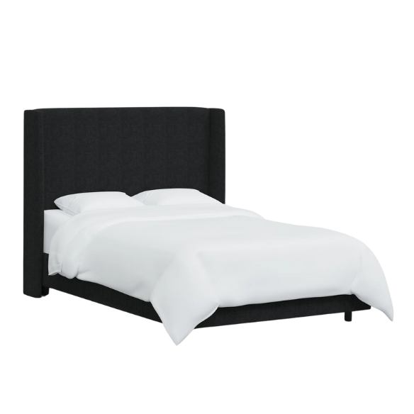 Black king-size upholstered bed in linen fabric with wingback headboard and low-profile black metal legs.

