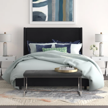 Black king-size upholstered bed in linen fabric with wingback headboard and low-profile black metal legs.

