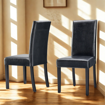 Set of 2 black PU leather Parsons dining chairs with cushioned seats and solid wood legs, designed for modern dining rooms or kitchens.

