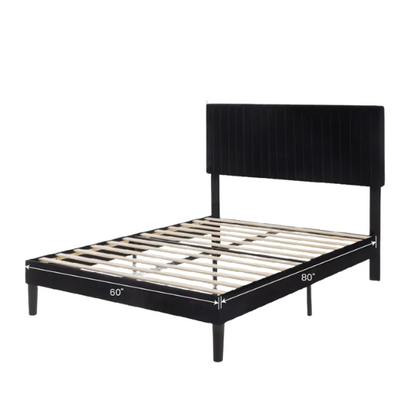 Black velvet upholstered queen bed with tufted wingback headboard and low-profile frame.

