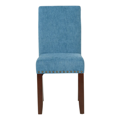 Blue denim upholstered Parsons chair with scrolled back, antique bronze nailhead trim, and solid wood legs