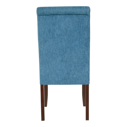 Blue denim upholstered Parsons chair with scrolled back, antique bronze nailhead trim, and solid wood legs