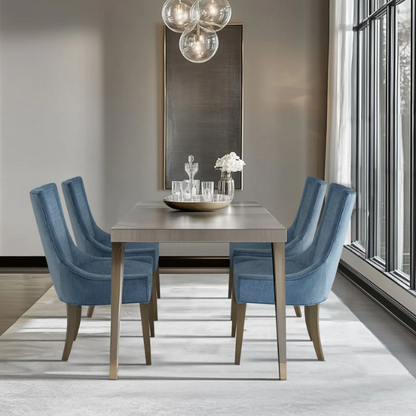 Set of 2 upholstered armless dining chairs in rich blue chenille with solid wood legs, high backs, and piped detailing.

