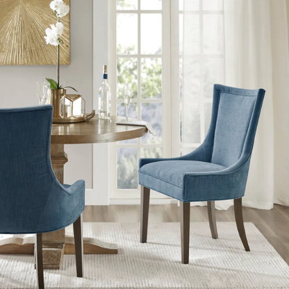 Set of 2 upholstered armless dining chairs in rich blue chenille with solid wood legs, high backs, and piped detailing.

