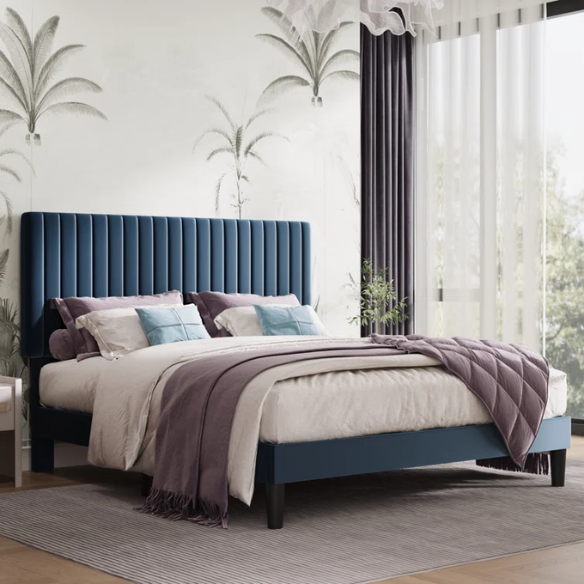 Blue velvet upholstered queen bed with tufted rectangular headboard and low-profile frame.

