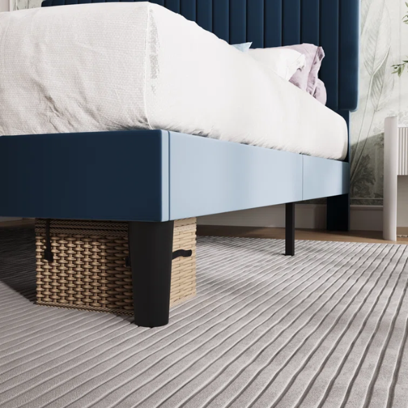 Blue velvet upholstered queen bed with tufted rectangular headboard and low-profile frame.

