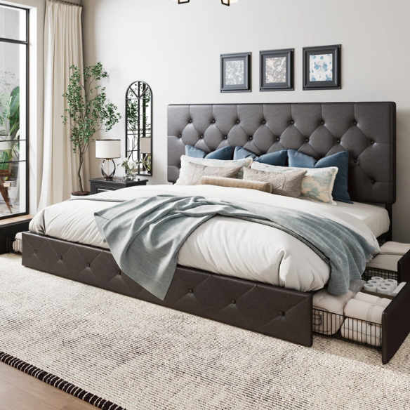 Brown faux leather queen bed with diamond-tufted headboard and four underbed storage drawers on wheels.


