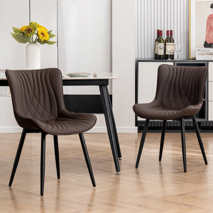 Set of 2 brown faux leather dining chairs with fishtail tufted backs and black metal legs, ideal for modern or rustic dining spaces.

