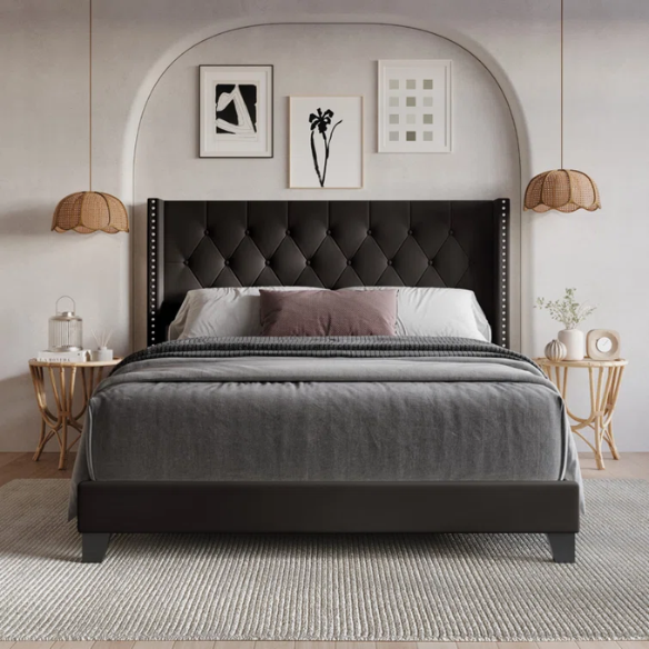 Queen-size bed in brown faux leather with tufted wingback headboard, nailhead trim, and low-profile wooden frame.

