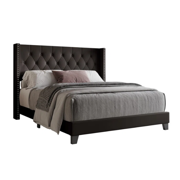 Queen-size bed in brown faux leather with tufted wingback headboard, nailhead trim, and low-profile wooden frame.

