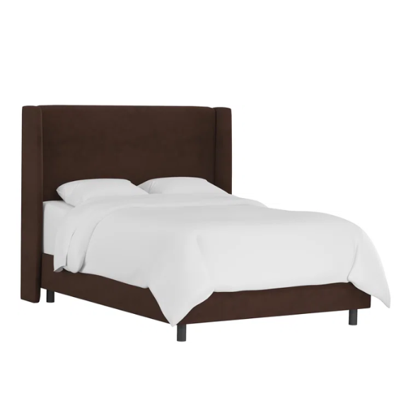 Brown king-size upholstered bed in velvet fabric with wingback headboard and low-profile black metal legs.

