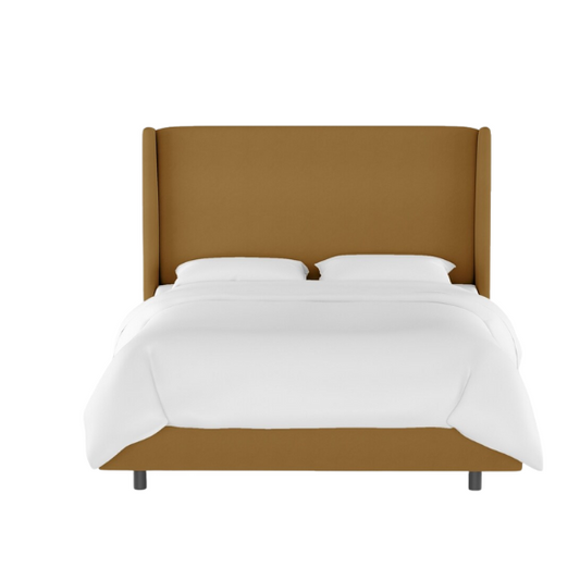 Camel king-size upholstered bed in velvet fabric with wingback headboard and low-profile black metal legs.

