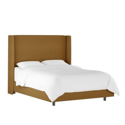 Camel king-size upholstered bed in velvet fabric with wingback headboard and low-profile black metal legs.

