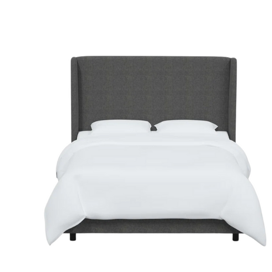Charcoal grey king-size upholstered bed in linen fabric with wingback headboard and low-profile black metal legs.

