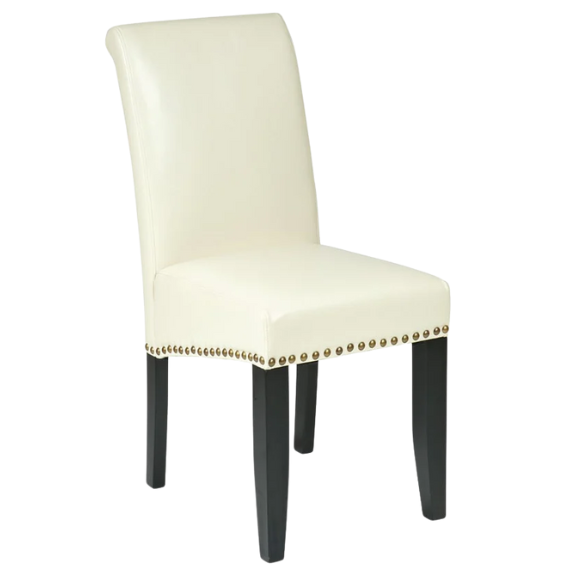 Cream faux leather Parsons chair with scrolled high back, antique bronze nailhead trim, and solid wood legs