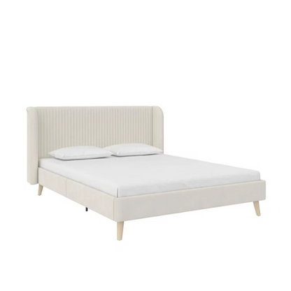 Light cream velvet upholstered queen platform bed with wingback tufted headboard and mid-century angled wood legs.

