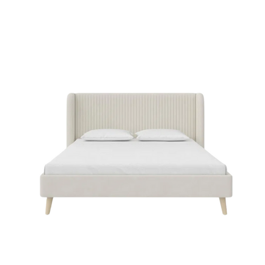 Light cream velvet upholstered queen platform bed with wingback tufted headboard and mid-century angled wood legs.

