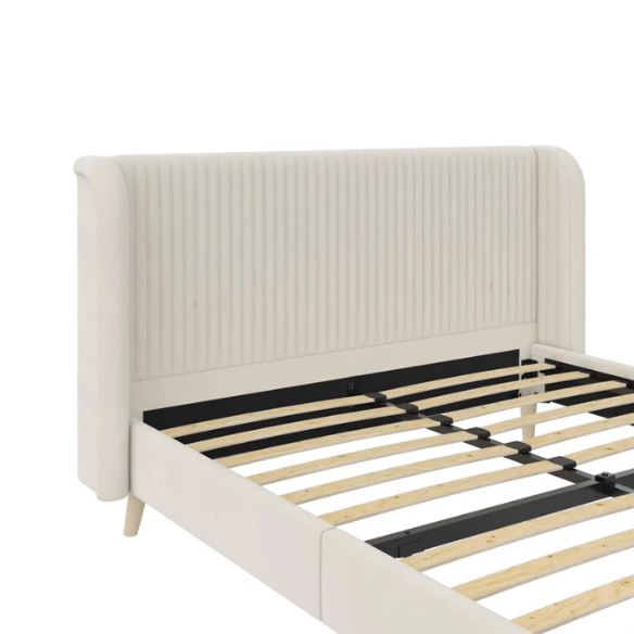 Light cream velvet upholstered queen platform bed with wingback tufted headboard and mid-century angled wood legs.

