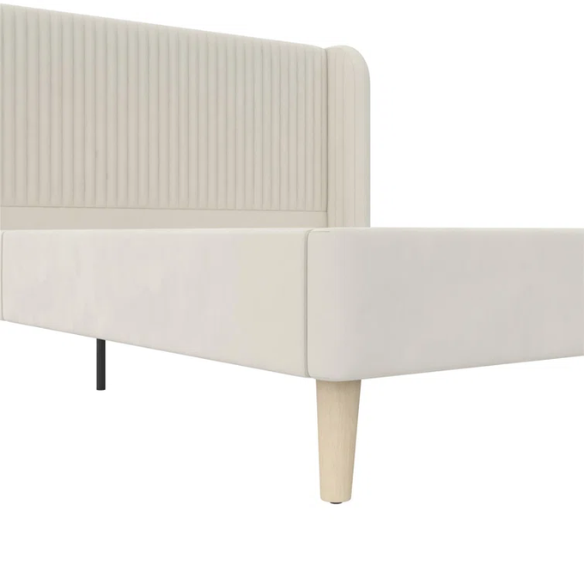 Light cream velvet upholstered queen platform bed with wingback tufted headboard and mid-century angled wood legs.

