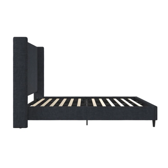 Dark blue canvas queen-size platform bed with tall wingback headboard and black tapered legs.

