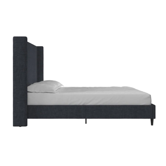 Dark blue canvas queen-size platform bed with tall wingback headboard and black tapered legs.

