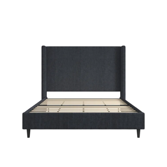 Dark blue canvas queen-size platform bed with tall wingback headboard and black tapered legs.

