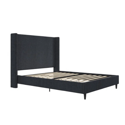 Dark blue canvas queen-size platform bed with tall wingback headboard and black tapered legs.

