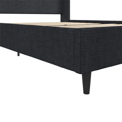 Dark blue canvas queen-size platform bed with tall wingback headboard and black tapered legs.

