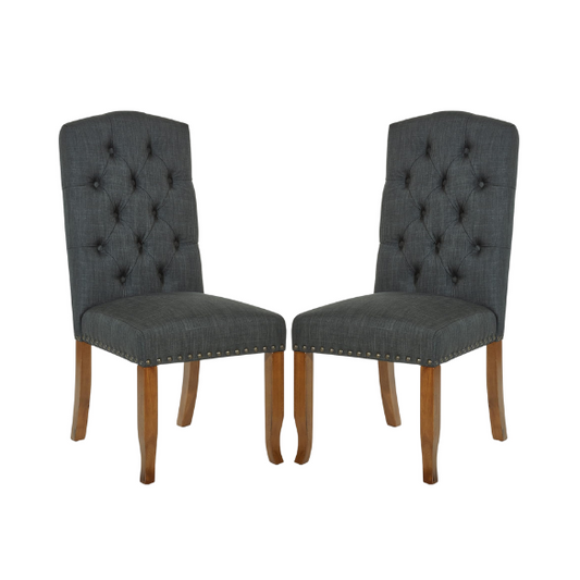 Set of 2 dark grey button-tufted farmhouse dining chairs with rustic wood legs, nailhead trim, and upholstered linen-like fabric.

