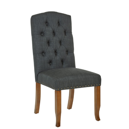 Set of 2 dark grey button-tufted farmhouse dining chairs with rustic wood legs, nailhead trim, and upholstered linen-like fabric.

