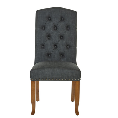 Set of 2 dark grey button-tufted farmhouse dining chairs with rustic wood legs, nailhead trim, and upholstered linen-like fabric.

