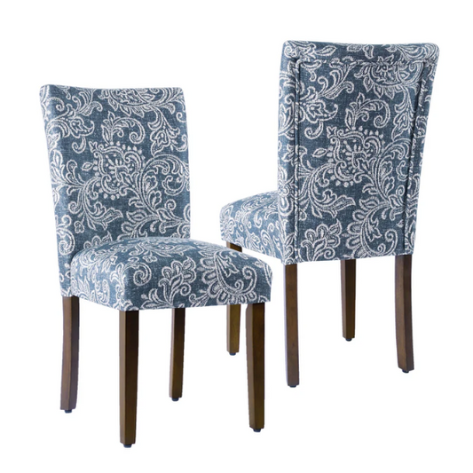 Set of two Parsons dining chairs with denim blue and white floral upholstery, high back design, scalloped seat front, and wood legs