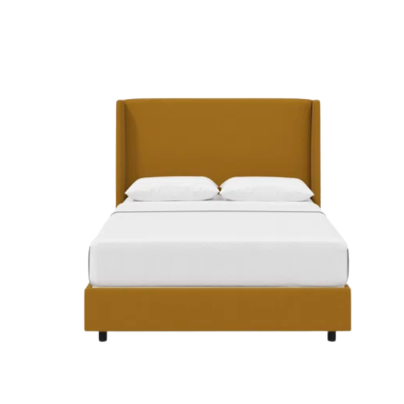 Dry copper king-size upholstered bed in velvet fabric with wingback headboard and low-profile black metal legs.

