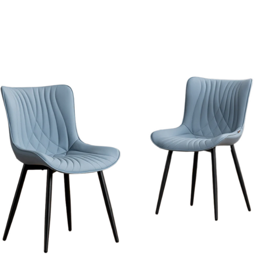 Set of 2 dusty blue faux leather dining chairs with fishtail tufted back and black metal legs, perfect for modern dining rooms or kitchen spaces.

