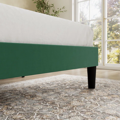 Emerald green velvet queen bed with tufted wingback headboard, 8-inch underbed clearance, and solid wood frame.

