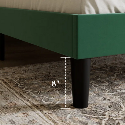 Emerald green velvet queen bed with tufted wingback headboard, 8-inch underbed clearance, and solid wood frame.

