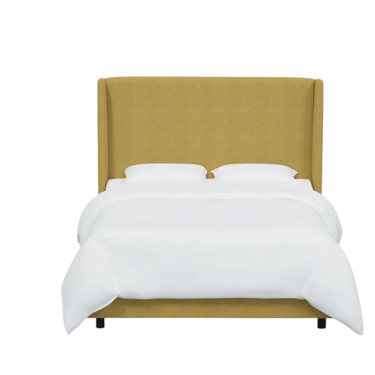 Golden yellow king-size upholstered bed in linen fabric with wingback headboard and black metal legs.

