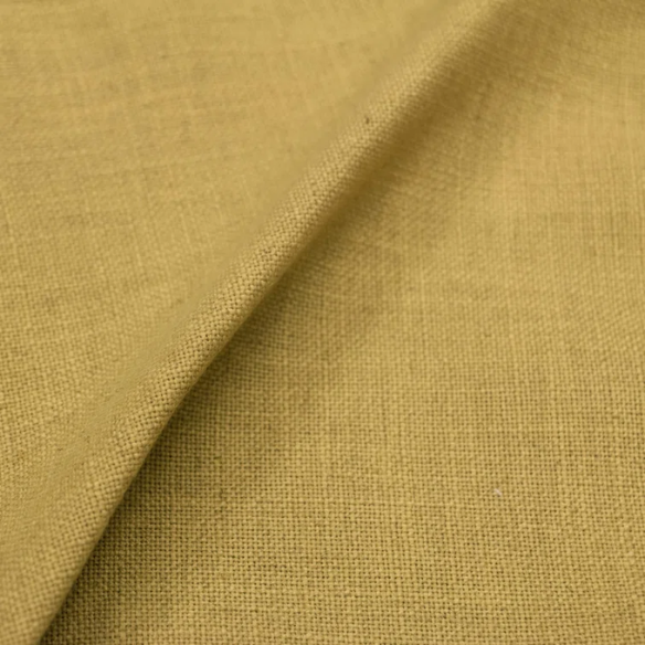 Golden yellow king-size upholstered bed in linen fabric with wingback headboard and black metal legs.

