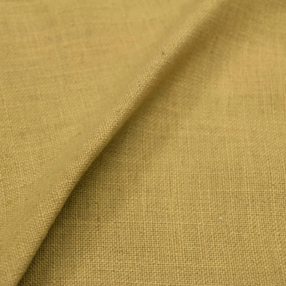 Golden yellow king-size upholstered bed in linen fabric with wingback headboard and black metal legs.

