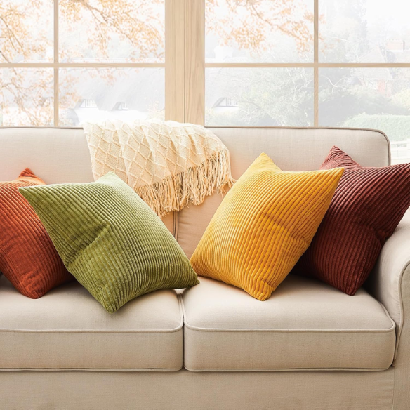 Set of 4 striped corduroy pillow covers in green, red, orange, and yellow – 18x18 decorative cushion covers with gradient pattern and hidden zippers for boho or festive home decor.
