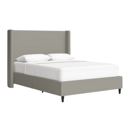 Grey canvas queen platform bed with extra-tall wingback tufted headboard and black tapered legs.

