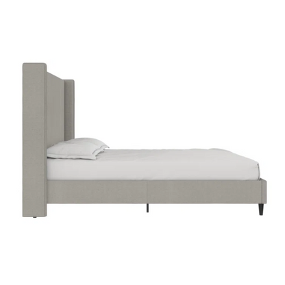 Grey canvas queen platform bed with extra-tall wingback tufted headboard and black tapered legs.

